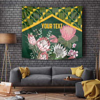 Green protea floral wall tapestry with gold kente geometric border and centered text panel