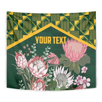 Green protea floral wall tapestry with kente geometric border and centered text area, curved