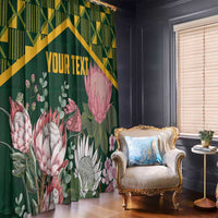 Green floral curtain with gold Kente-style diagonal band, pink protea blooms, and YOUR TEXT