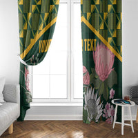 Green floral curtain panel with gold geometric top band and pink protea on right side