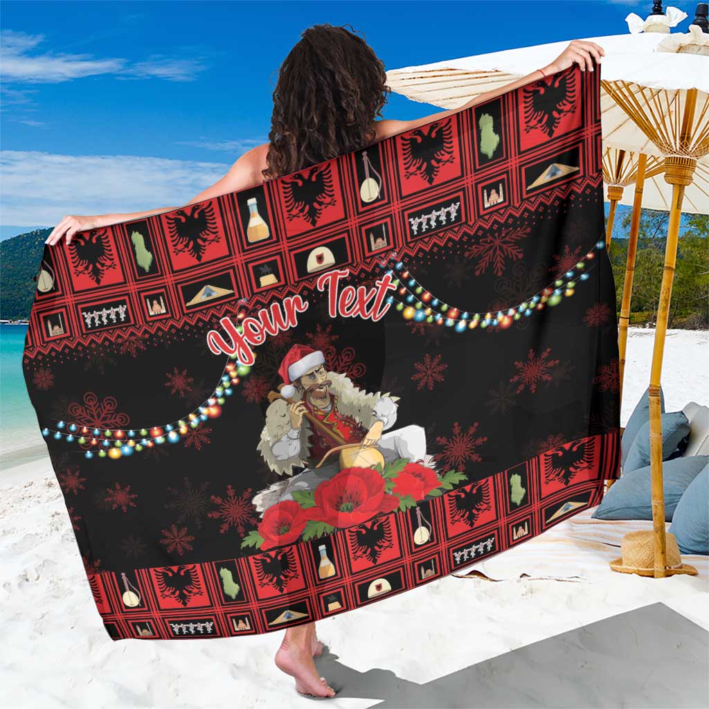 Personalized red and black patterned Christmas sarong with “Your Text” and floral graphics