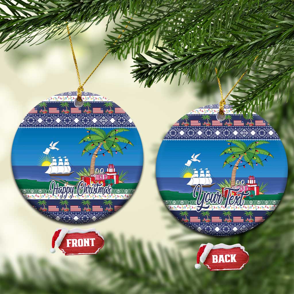Round blue ceramic Christmas ornament with ship, palm tree, and “Happy Christmas” text