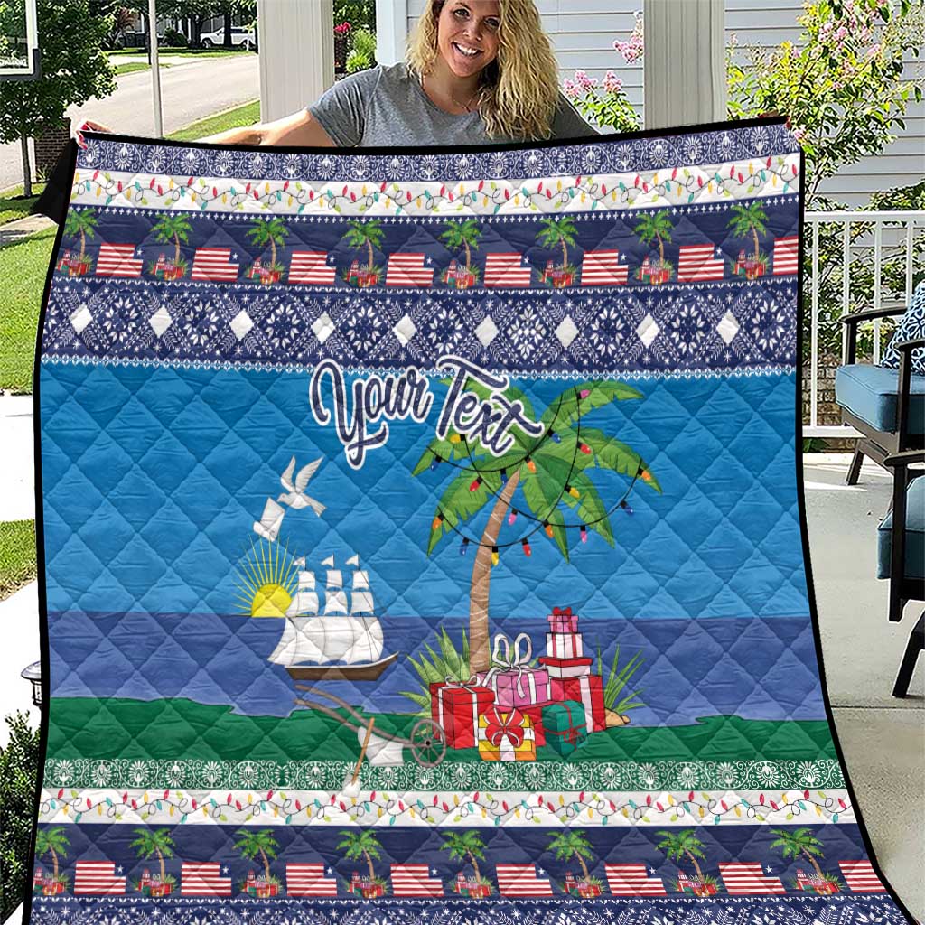 Blue personalized quilt with palm trees, boats, and red gift boxes, liberty-themed border