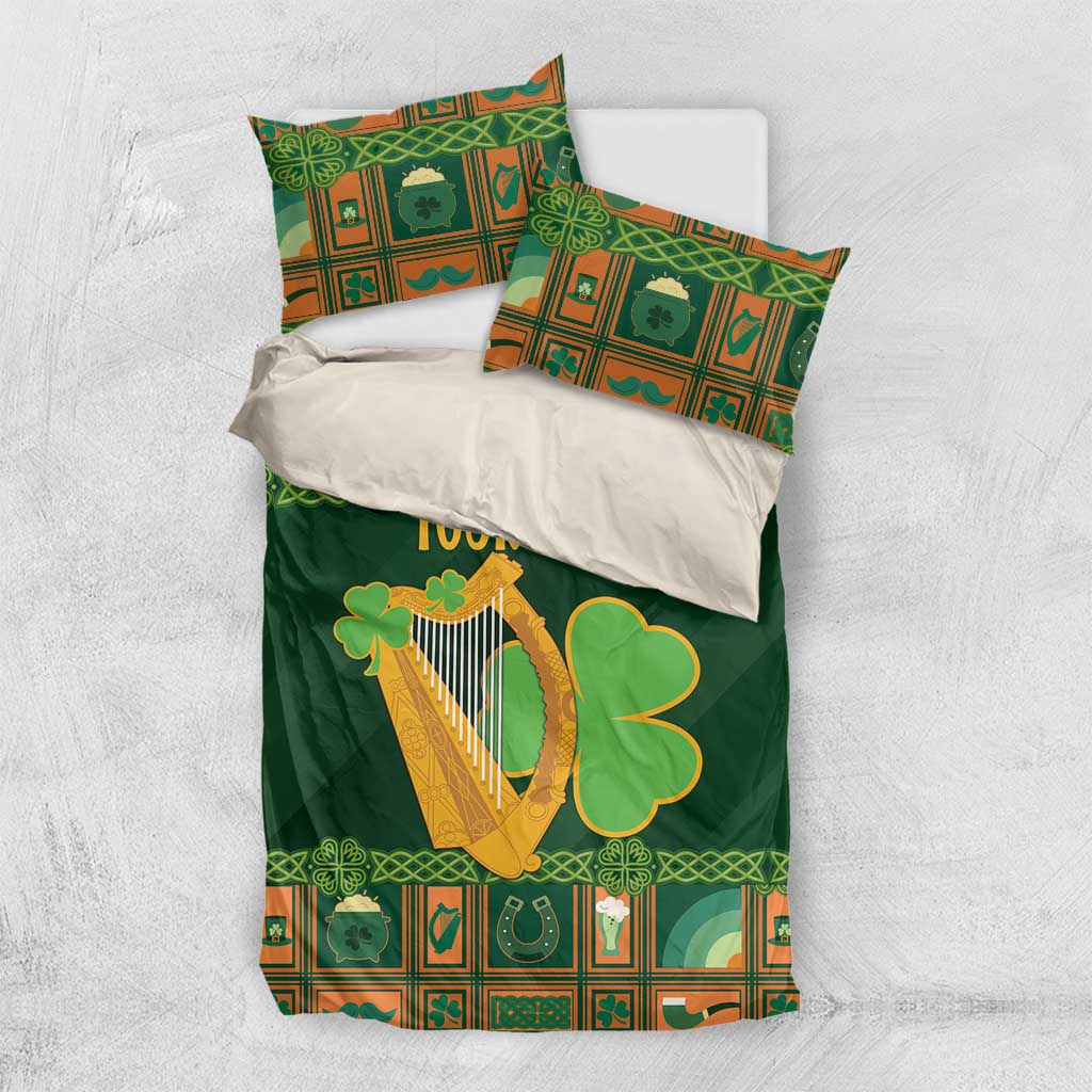 Green Christmas bedding set with harp and shamrock, shown with matching pillowcases