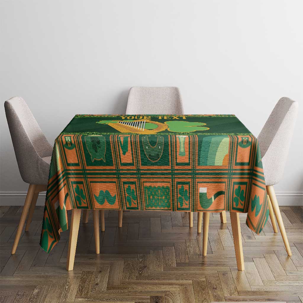 Green Irish tablecloth with harp and shamrock motifs on dining table