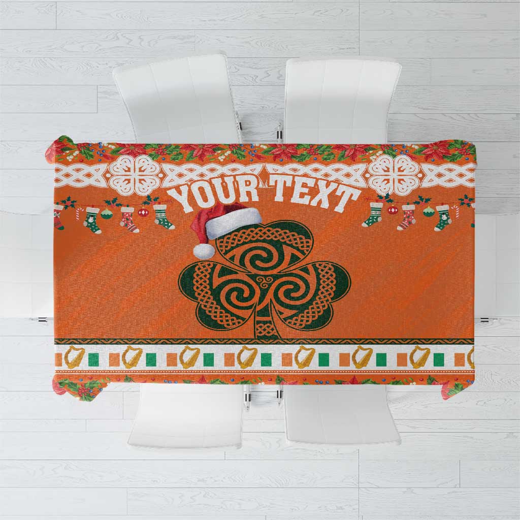 Orange Christmas tablecloth with large shamrock and festive border pattern