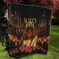 Black St. Lucy quilt resting on grass, diamond quilting with candle glow, roses, and St. Lucy text