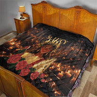 Black St. Lucy quilt on a bed, diamond stitching with candle lights, roses, and golden portrait