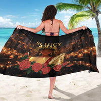Black sarong wrap with back print showing St.LUCY text, face, and roses