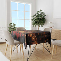 Black St. Lucy tablecloth draped on dining table with candle and city skyline print