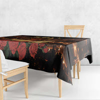 Black St. Lucy tablecloth corner drop featuring red tulip-like flowers and candlelight