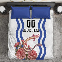White bedding set with blue wave stripes, pink floral artwork, and two blue pillowcases
