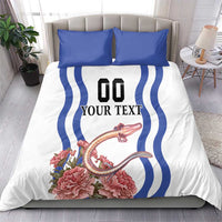 White duvet and pillowcases set with blue wave stripes, “YOUR TEXT” panel, pink flowers