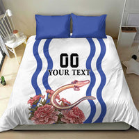 White duvet cover with blue wave stripes and “YOUR TEXT”, pink floral design, blue pillows