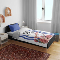 Bedroom bed setup with white bedding featuring blue wave stripes, “YOUR TEXT”, pink floral print