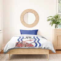 White duvet and pillows with blue wave stripes, “YOUR TEXT” text, and pink floral artwork
