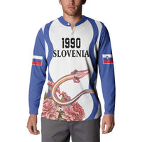 White and blue raglan button sweatshirt on model: 1990 Slovenia text with dragon and flowers