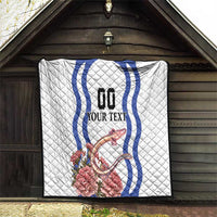 White quilt hanging under a roof with blue wavy emblem, custom text, and carnation dragon art.