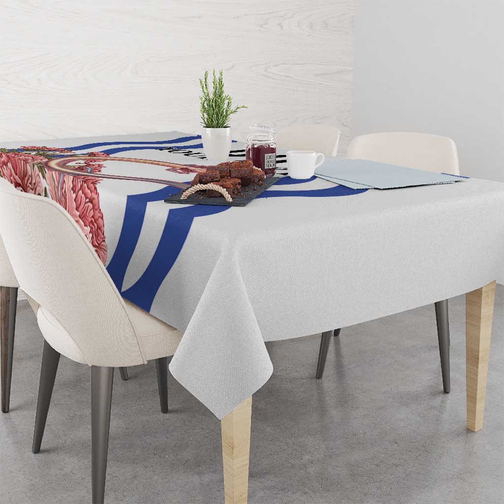 Custom Slovenia Independence Day tablecloth on a tabletop, white with blue stripe and pink accents