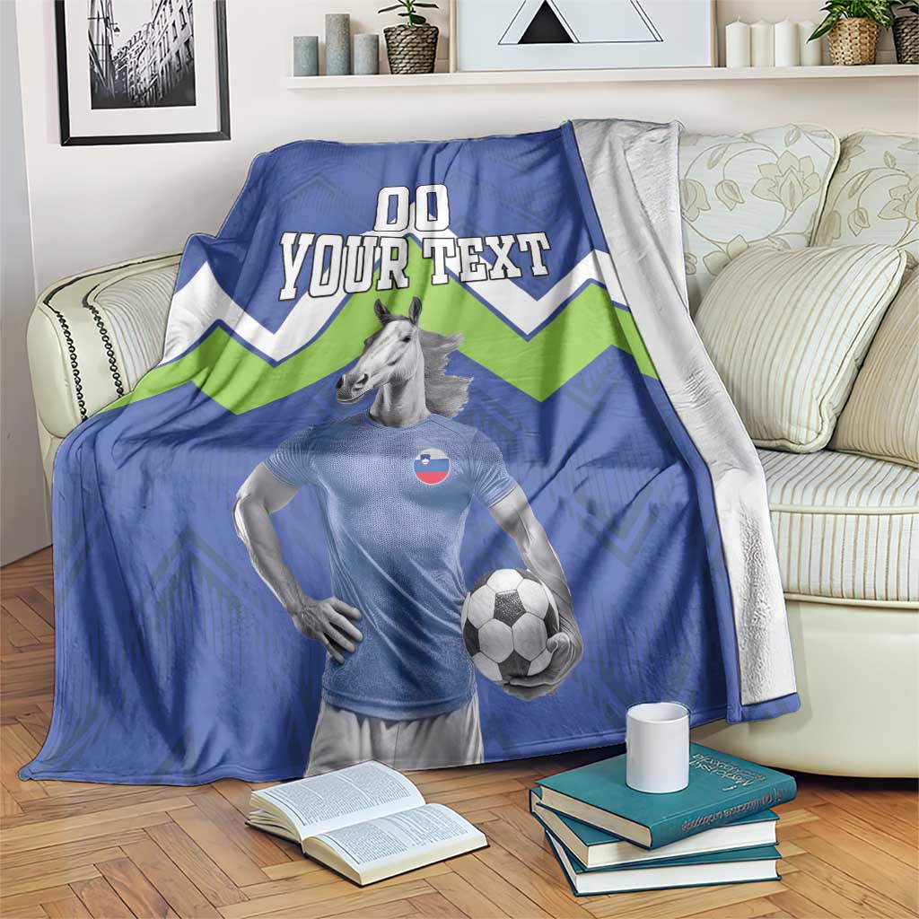 Blue football-style blanket with green chevrons, horse graphic, and 'YOUR TEXT'.
