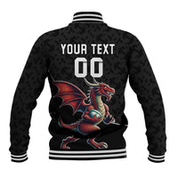 Black varsity baseball jacket back with striped ribs, dragon graphic, and large custom text