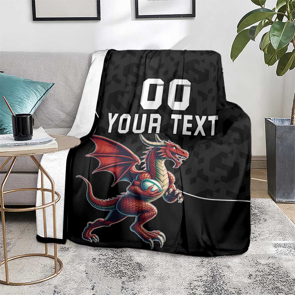 Black rugby blanket showing red dragon mascot with 'YOUR TEXT' and '00' print
