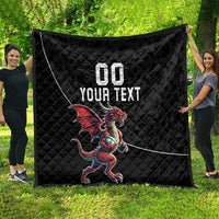 Black quilted blanket with Welsh dragon mascot and custom text, fully spread