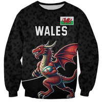 Black Wales rugby sweatshirt with red dragon mascot graphic on front