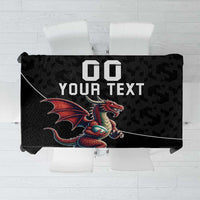 Black rugby tablecloth with repeating geometric pattern and dragon mascot graphic