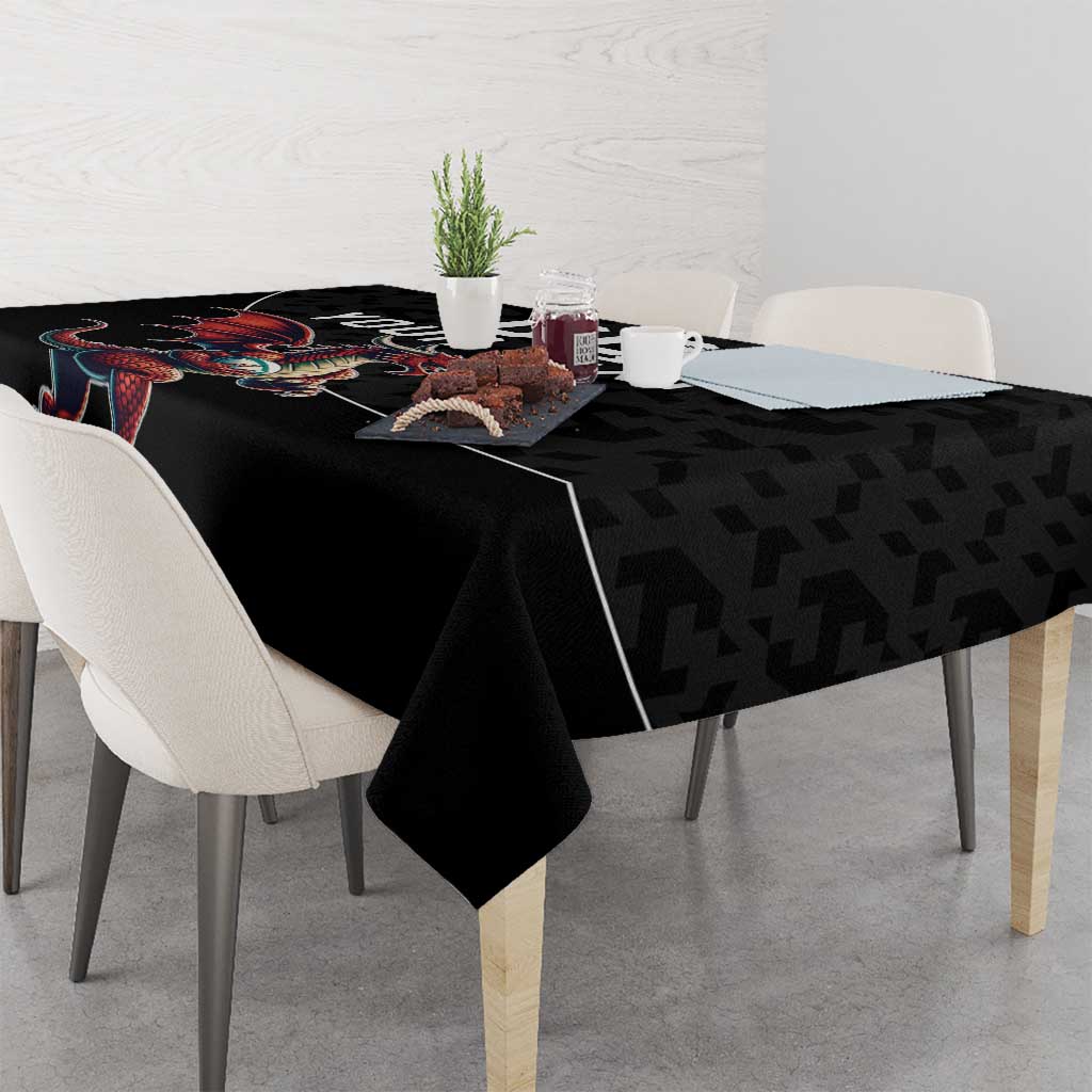 Black rugby tablecloth with dragon mascot graphic on corner of table