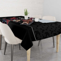 Black rugby tablecloth with dragon mascot graphic on corner of table