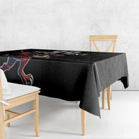Black rugby tablecloth with dragon mascot graphic along the table edge