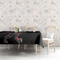 Black rugby tablecloth with dragon mascot graphic on dining table front