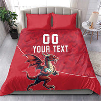 Red duvet and two matching pillows with dragon mascot and white "DO YOUR TEXT" graphic