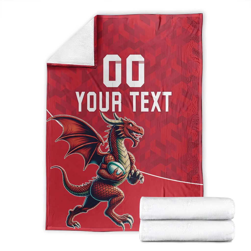 Folded red rugby blanket with dragon mascot and "YOUR TEXT" shown with white towels