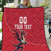 Red quilt blanket with diamond stitching, Welsh dragon graphic, 'YOUR TEXT' and '00'.