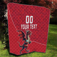 Red quilt blanket with Welsh dragon mascot, '00 YOUR TEXT' design, diamond quilting.