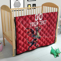 Red quilt blanket in a nursery, Welsh dragon graphic with 'YOUR TEXT' and '00'.