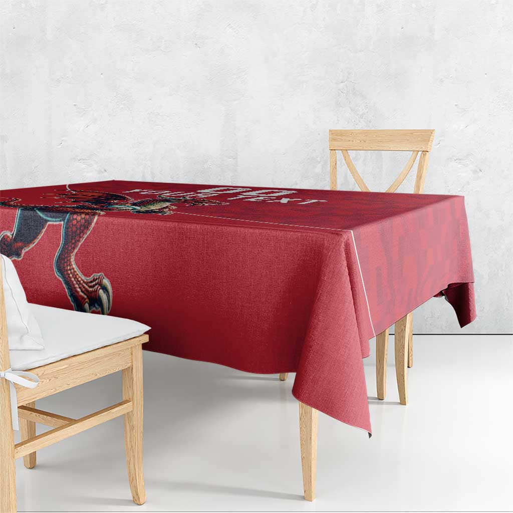 Red rugby tablecloth with Welsh dragon mascot on table, side corner drape