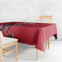 Red rugby tablecloth with Welsh dragon mascot on table, side corner drape