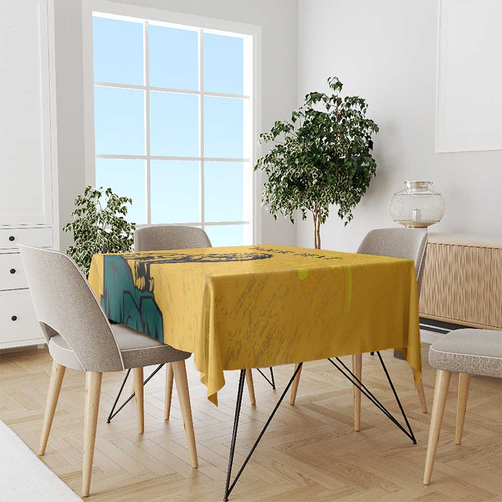 Yellow tablecloth with lion and traditional sun-face graphic, draped over dining table