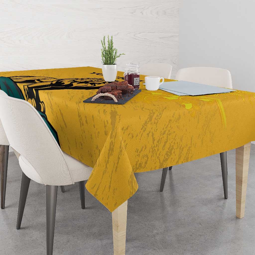 Yellow tablecloth with lion and sun-face print, placed on a dining table