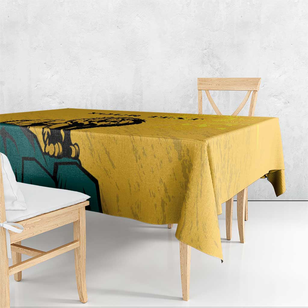 Yellow tablecloth with lion graphic, draped over table edge