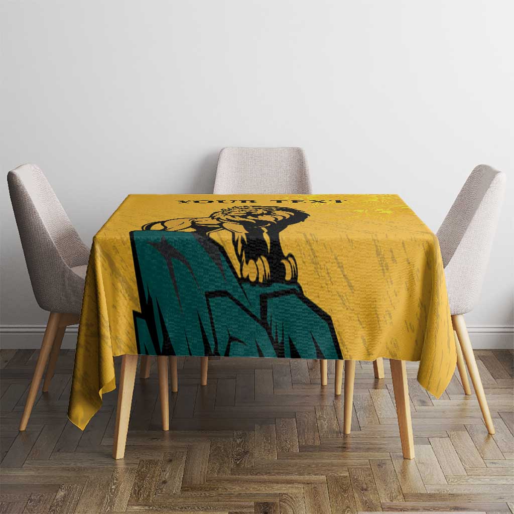 Yellow tablecloth with lion and sun-face design on dining table