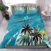 Blue bedding set with palm tree graphic and bold "YOUR TEXT" banner across duvet
