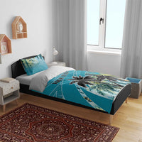 Blue bedding set with palm tree artwork and "YOUR TEXT" print on duvet in bedroom