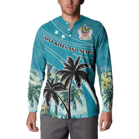 Blue button sweatshirt on model with palm tree print and crest