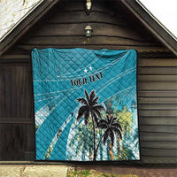 Blue quilt featuring palm trees and "YOUR TEXT" text, diamond quilting detail