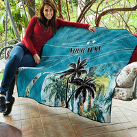 Blue throw quilt with palm trees and "YOUR TEXT" across the center panel