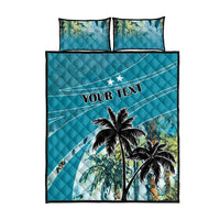 Blue quilt bed set front view with palm tree art and 'YOUR TEXT' on quilt, two pillows